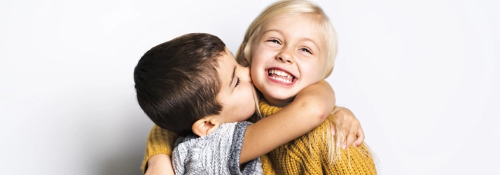 Chiropractic Vadnais Heights MN Smiling Kids Two kids hugging.